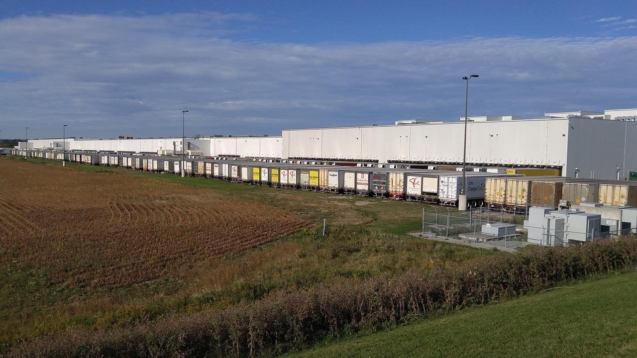 Rows of Trucks Parked Outside a Food and Beverage Warehouse